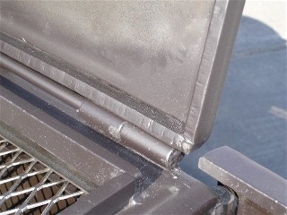 corner photo of a 1/2 hinch firebox from a portable bbq smoker